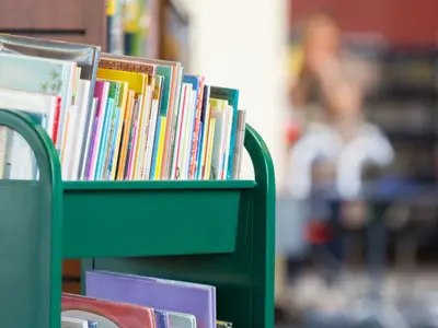 Library Cart With Books Waiting To Be Shelved