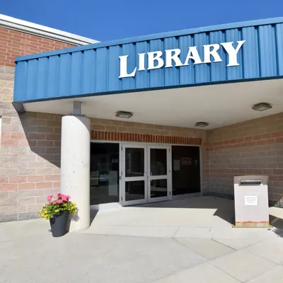Front entrance of Caledonia Library with "Library" sign