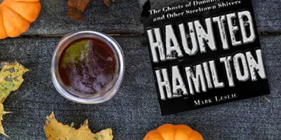 Book Cover beside fall beverage