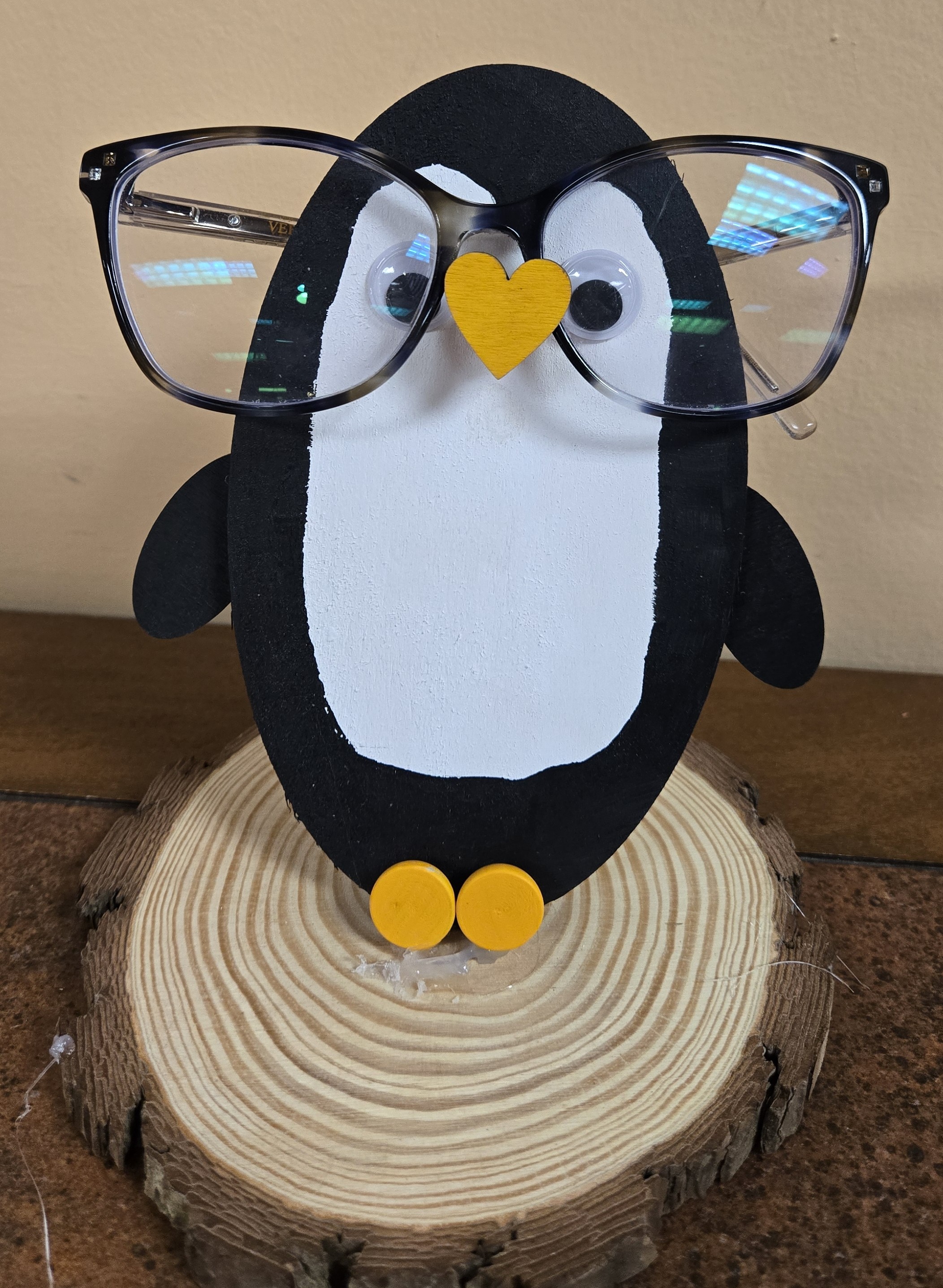 Wooden Penguin with Human Eyeglasses on its nose